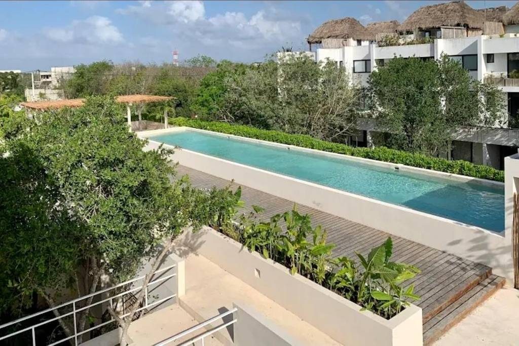 Departamento de 1 Recámara con jardin y alberca privada en Venta en La Veleta Tulum
